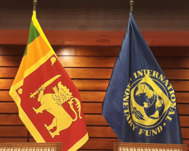 Confident female leader conducting an investment strategy meeting with the Sri Lanka Opportunity Fund team in a modern office.